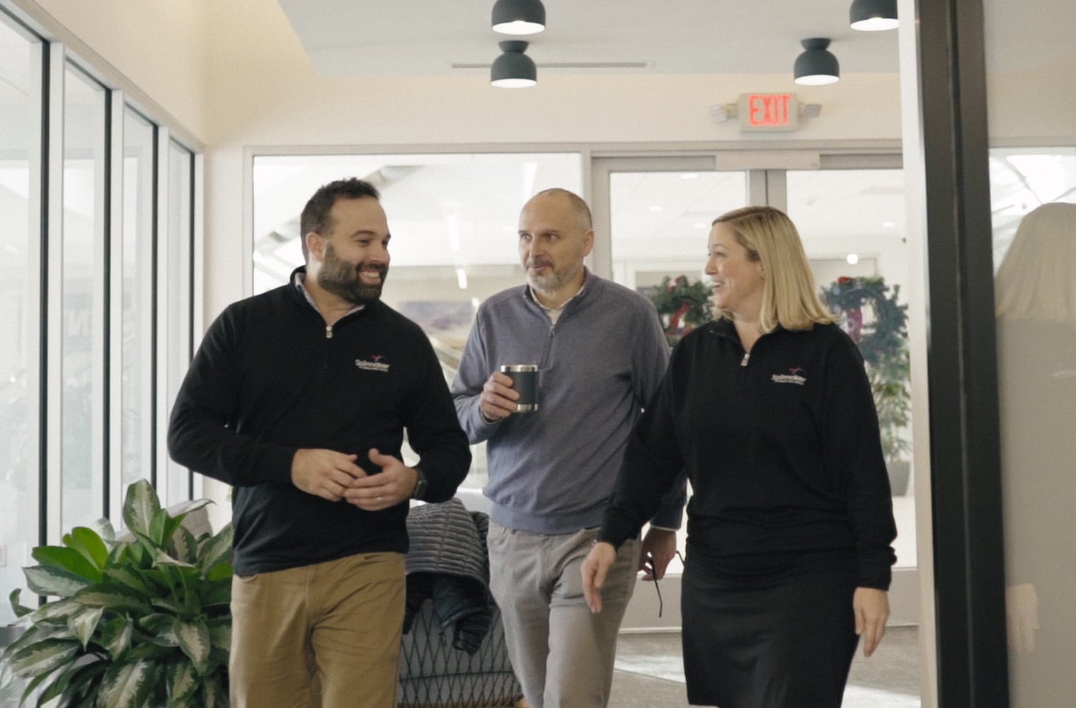 Spinnaker team walking through the office.