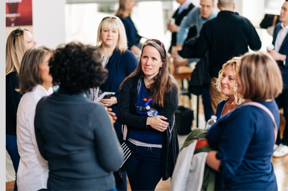 Spinnaker team talking during a conference.