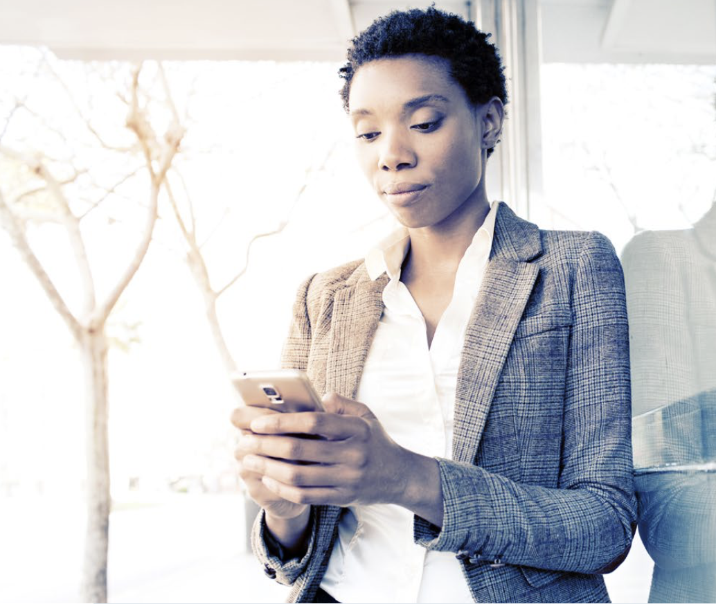 professional woman looking at her phone